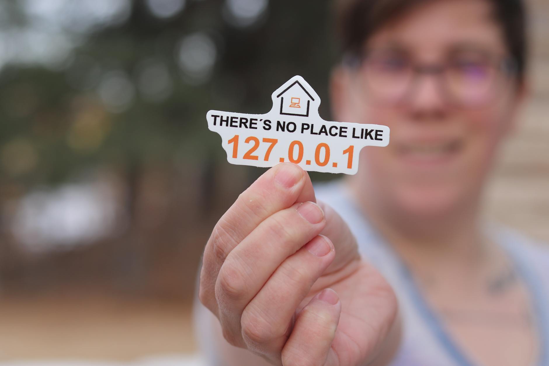 person holding logo of there is no place like home